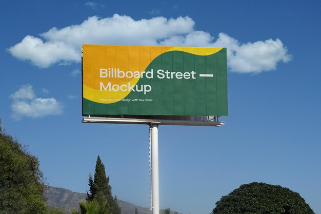 Large billboard mockup on blue sky with clouds