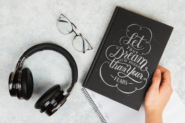 Let your dream be bigger than your fears quote book and headphones