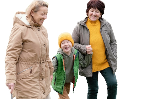 Little boy spending time outdoors with his grandmothers