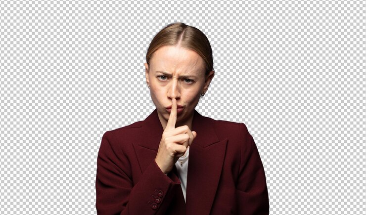 Free PSD looking serious and cross with finger pressed to lips demanding silence or quiet keeping a secret