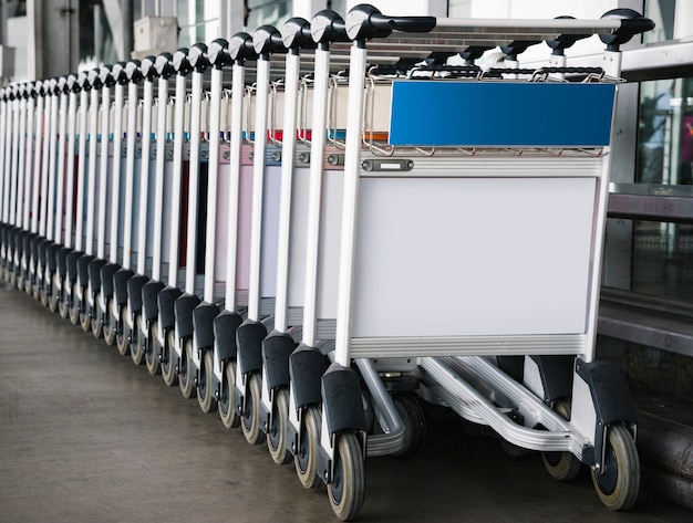 Luggage trolley at the airport with sign mockup