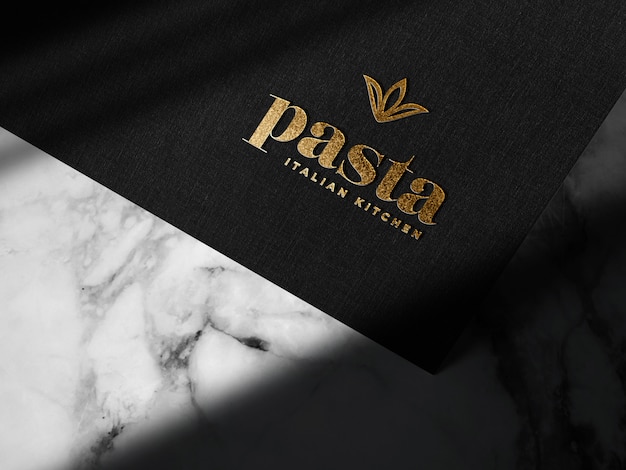 Free PSD luxury embossed gold logo mockup on black paper