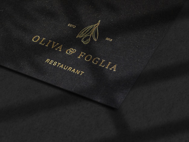 luxury embossed logo mockup on black paper texture