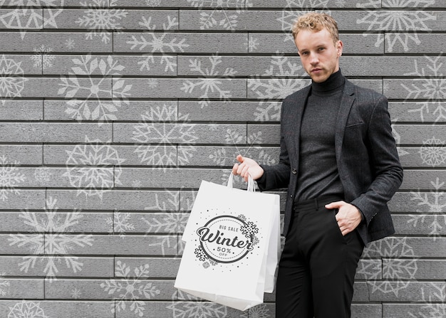 Male In Black Suit With Shopping Bags