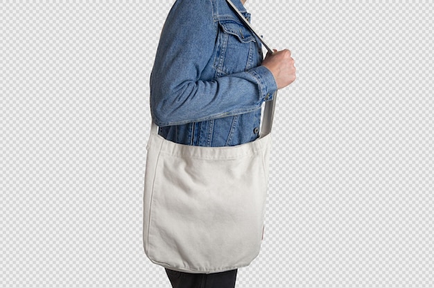 Male model holding a white tote bag