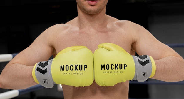 Man wearing boxing gloves mock-up for training