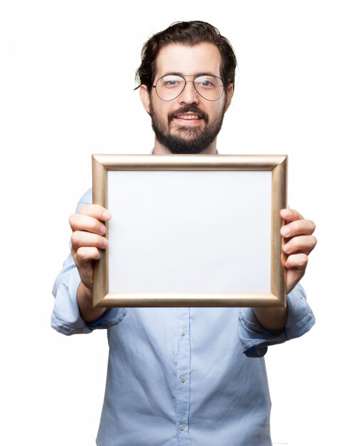 Man with glasses holding a frame