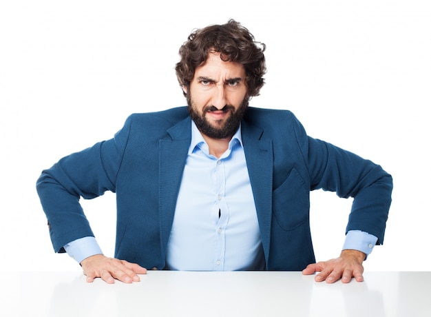 Man with hands on desk