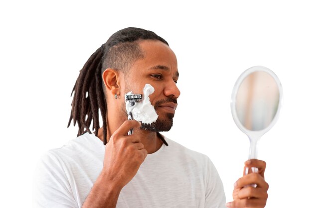 medium shot man shaving