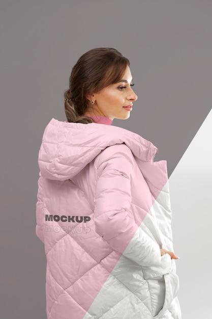 Medium shot woman presenting winter jacket Free Psd