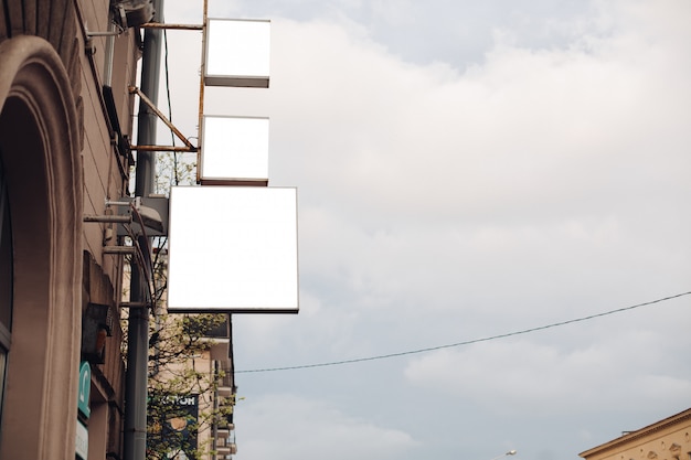 A medium-sized Billboard on a city street attracts attention, mockup