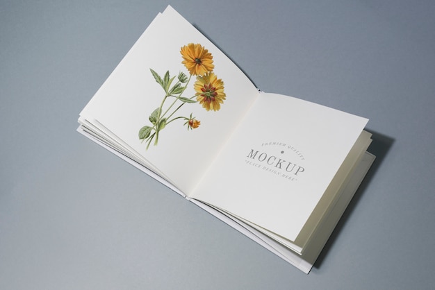 Mid fold book mockup with floral illustration