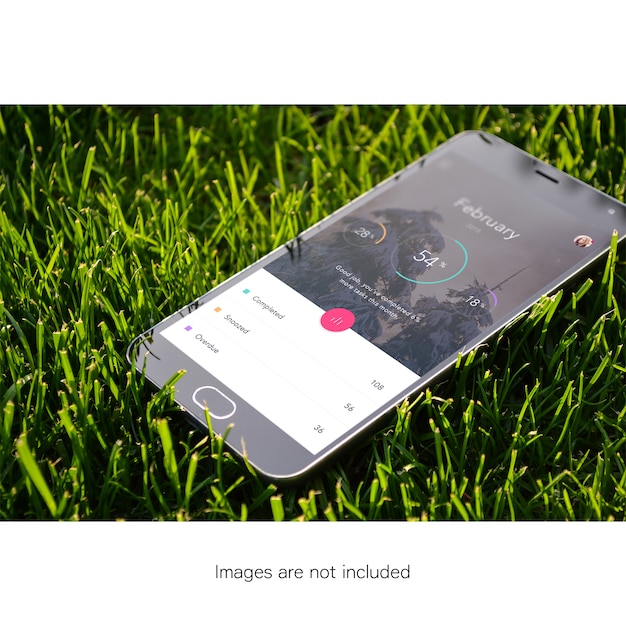 Free PSD mobile phone on grass mock up