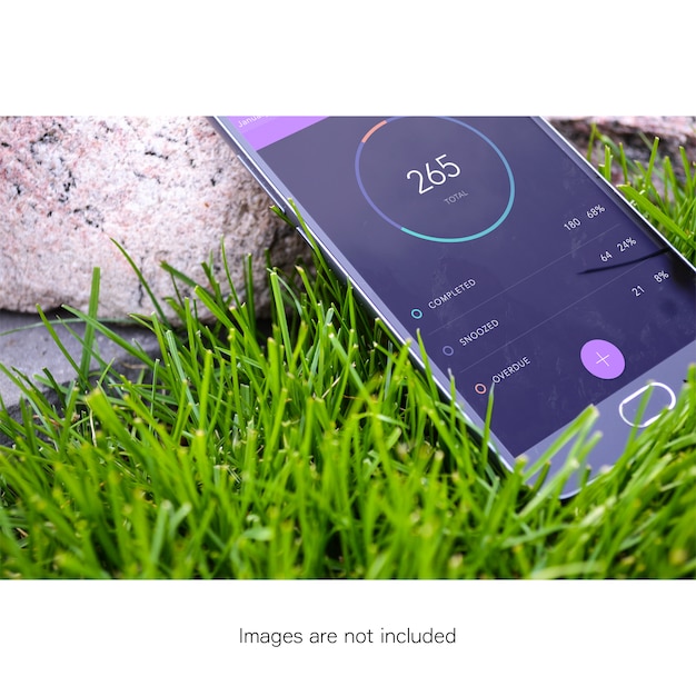 Free PSD mobile phone on grass mock up