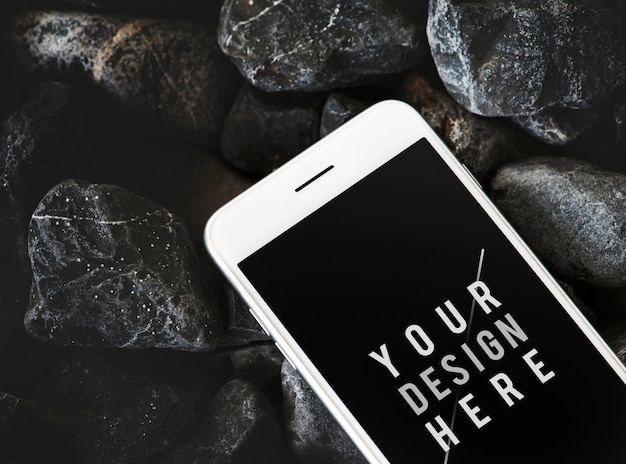 Free PSD mobile phone on a rocky surface