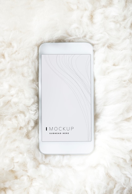 Free PSD mobile phone screen mockup on fur surface