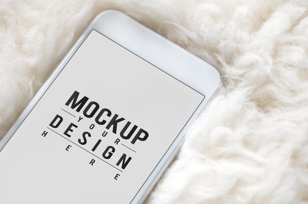 Mobile phone screen mockup on fur surface