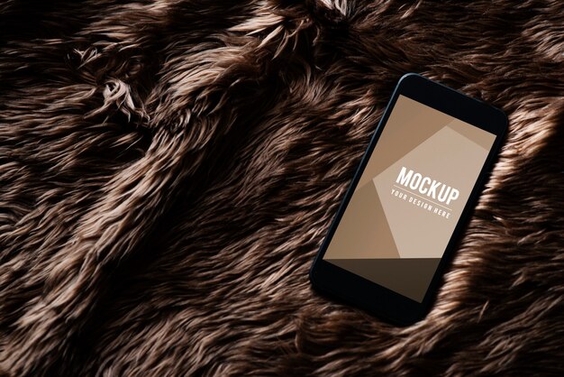 Mobile phone screen mockup on fur surface