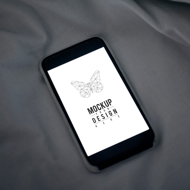 Mobile Phone Screen Mockup on Sheet Surface – Free PSD Download