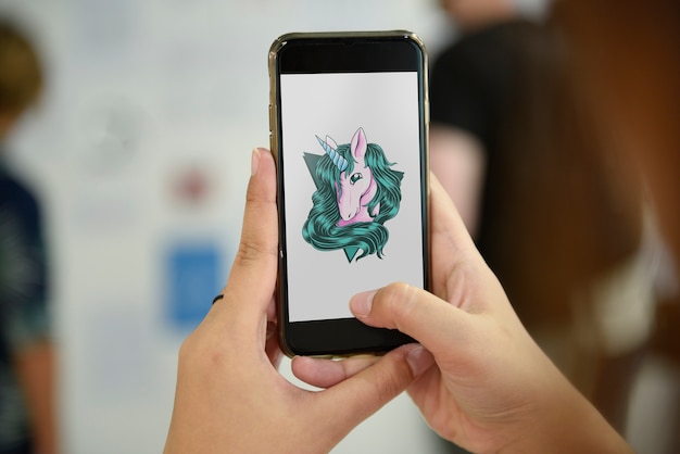 Mobile phone showing unicorn graphic