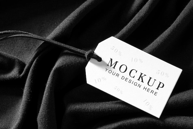 Mock-up of clothing label on black soft fabric