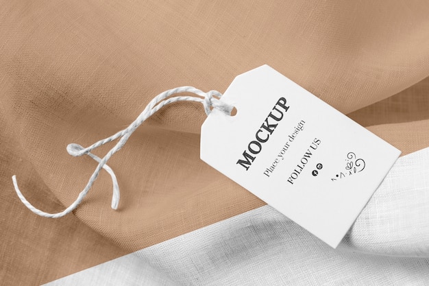Mock-up of clothing label on brown soft fabric