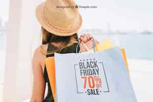 Free PSD mock up design with woman holding shooping bags