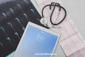 Free PSD mock up with medical equipment and tablet's screen