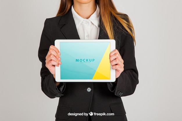 Mockup concept of business woman holding tablet