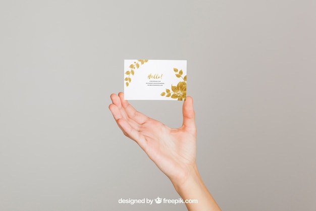 Mockup concept of hand holding business card