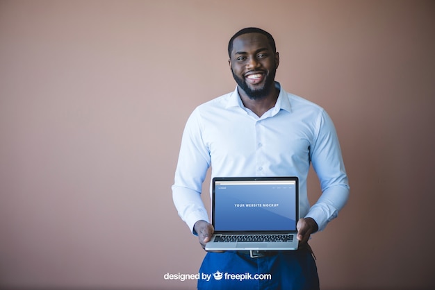 Modern businessman presenting laptop