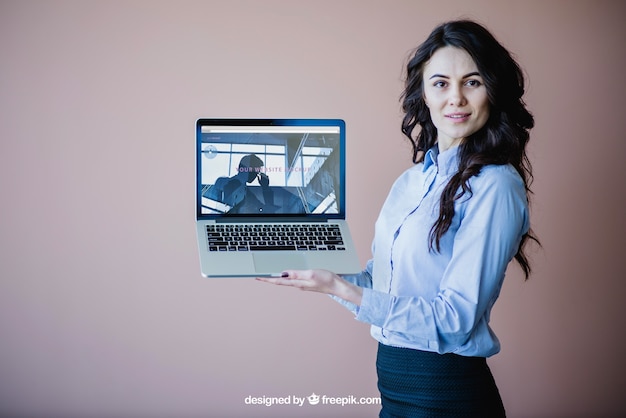 Modern businesswoman presenting laptop