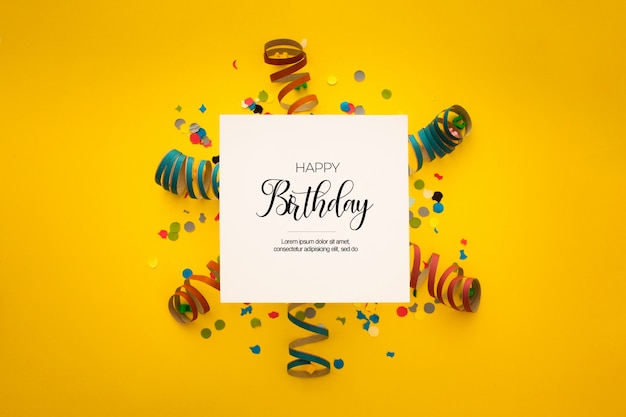 Free PSD nice birthday composition with confetti on yellow