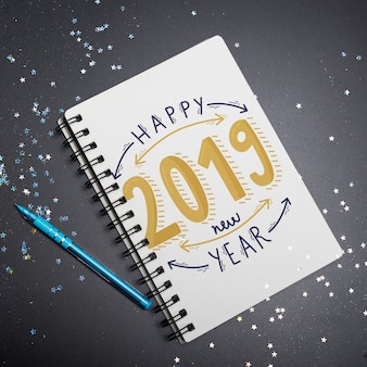 Notebook mockup with new year concept