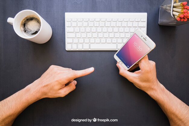 Office desk and finger pointing phone