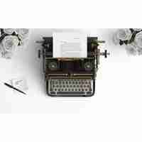 Free PSD old typewriter on a desktop with white roses