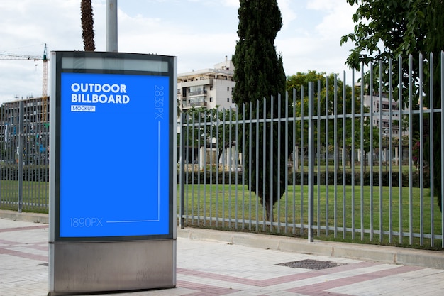 outdoor billboard next to park