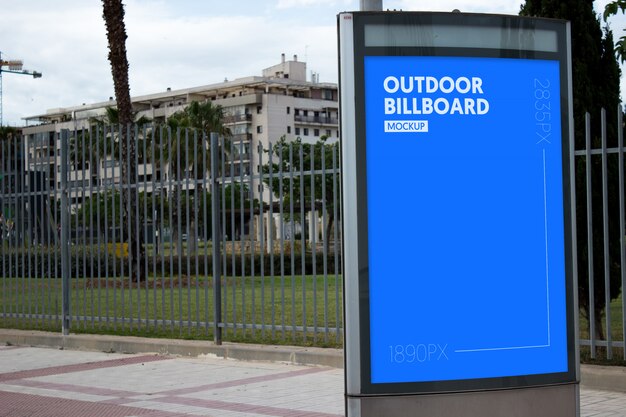 outdoor billboard next to park