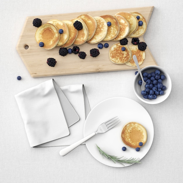 Free PSD pancakes on board and plate with berries