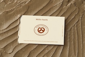 Pastries business card mockup psd on brown frosting texture