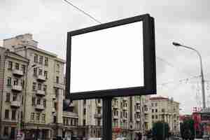 Free PSD picture of a large outdoor doard for displaying advertisements next to the avenue