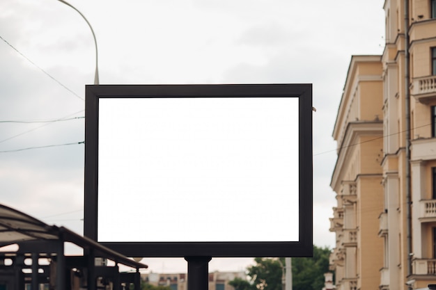 Free PSD picture of a large outdoor doard for displaying advertisements next to the avenue