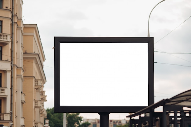 Picture of a large outdoor doard for displaying advertisements next to the avenue