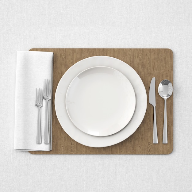 Plates and cutlery over wooden tray
