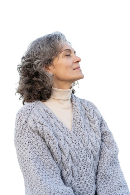 portrait of adult woman spending time outdoors by herself