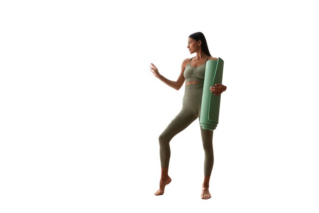 portrait of female yoga instructor with mat