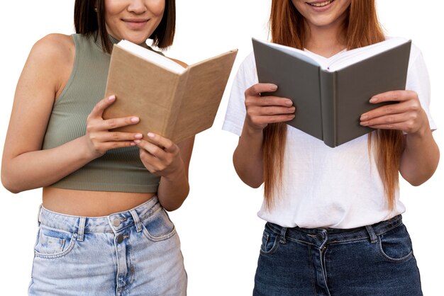 portrait of young girls reading book
