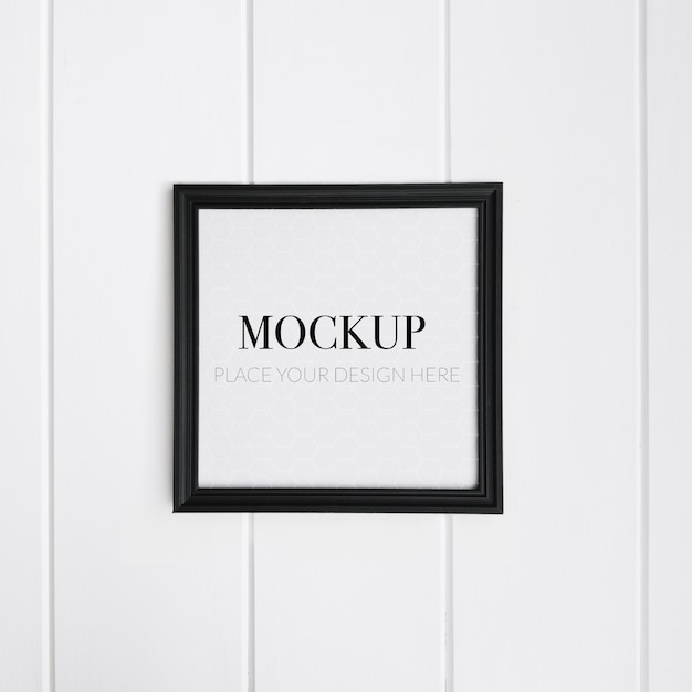 Realistic black frame on white wall for mockup