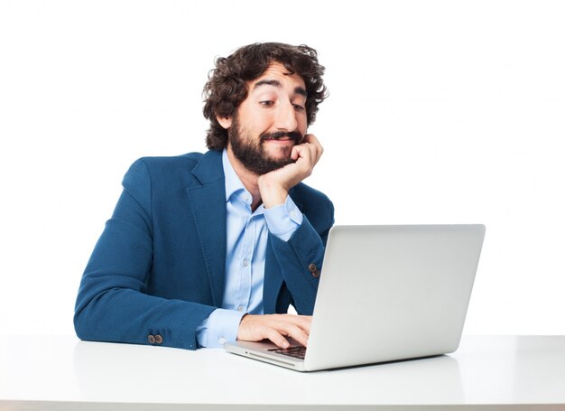 Relaxed businessman typing on his computer