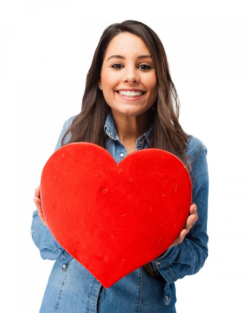 Romantic teenager holding a heart